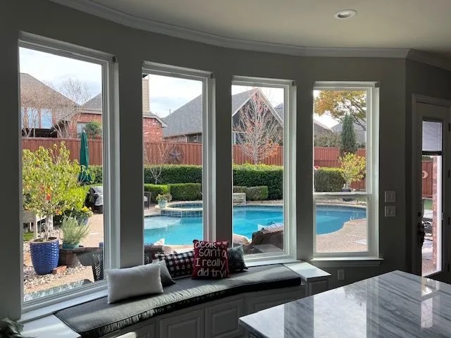 EcoView replacement windows overlooking a backyard pool