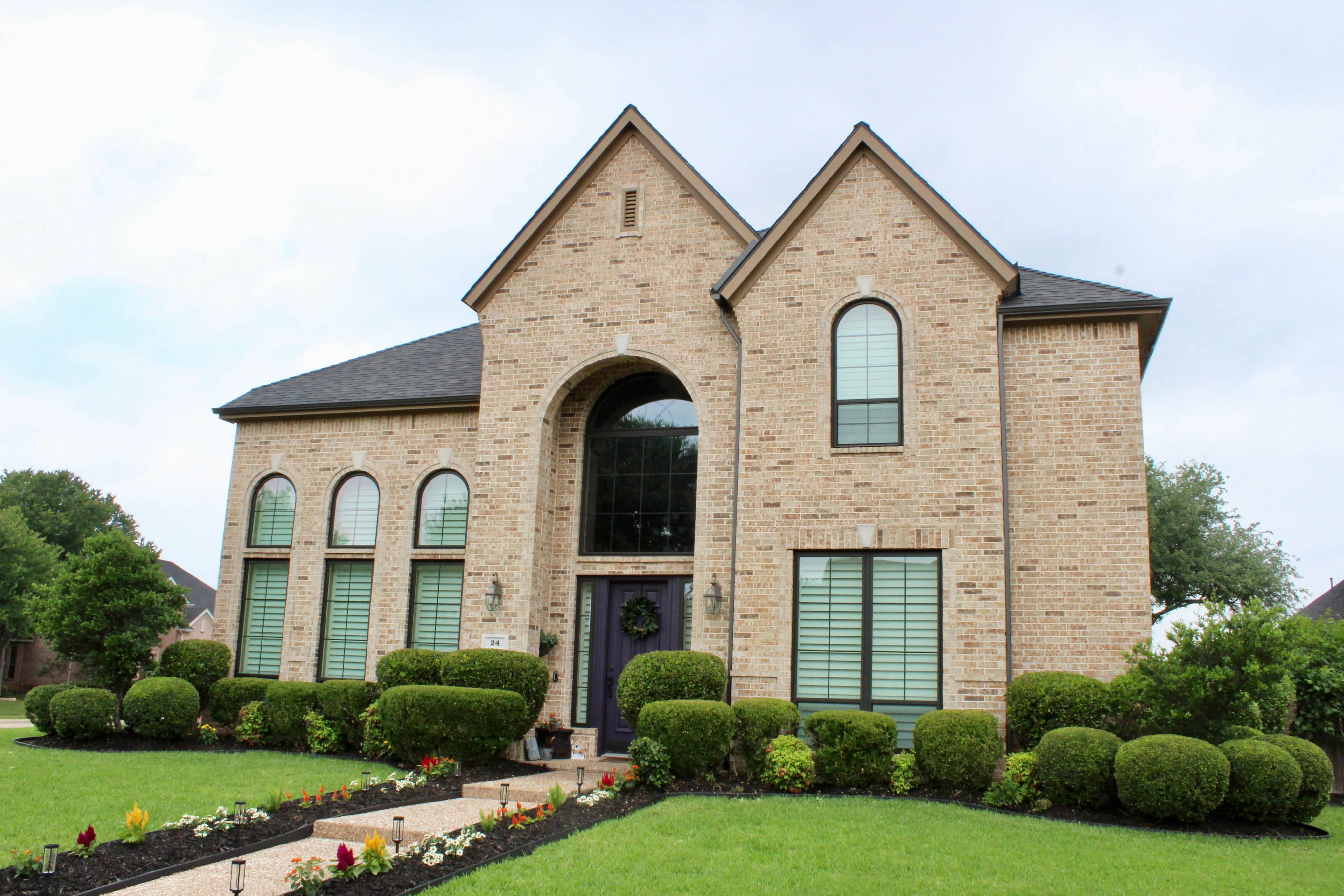 Texas home with tall arched EcoView replacement windows